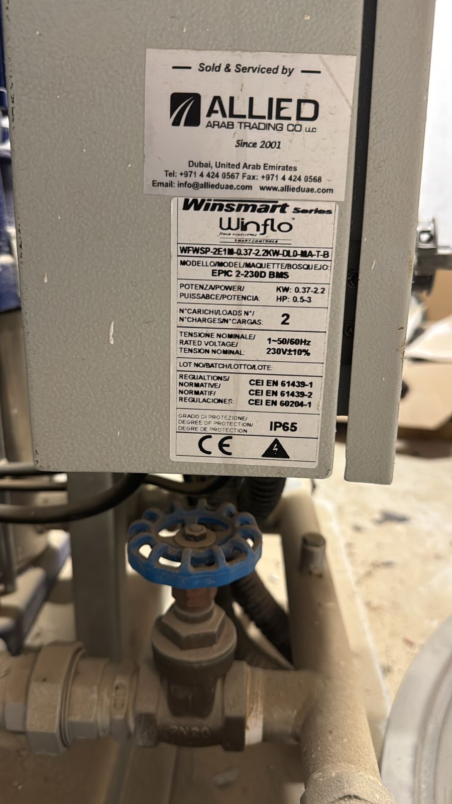 Winflo controller nameplate fixed to the outside of an installed enclosure